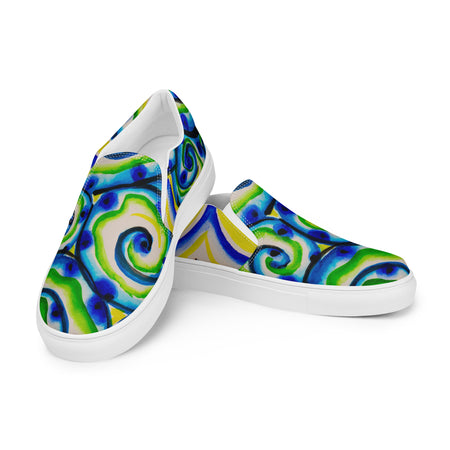 womens slip on canvas shoes with all over multicolored print in swirling blues and greens